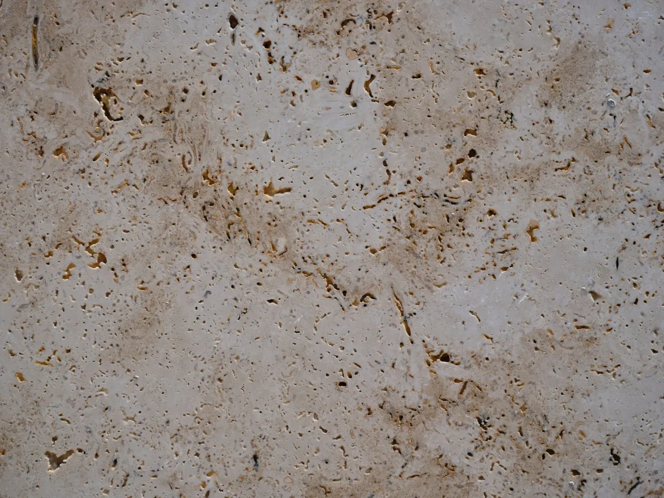 Close-up of travertine stone surface.