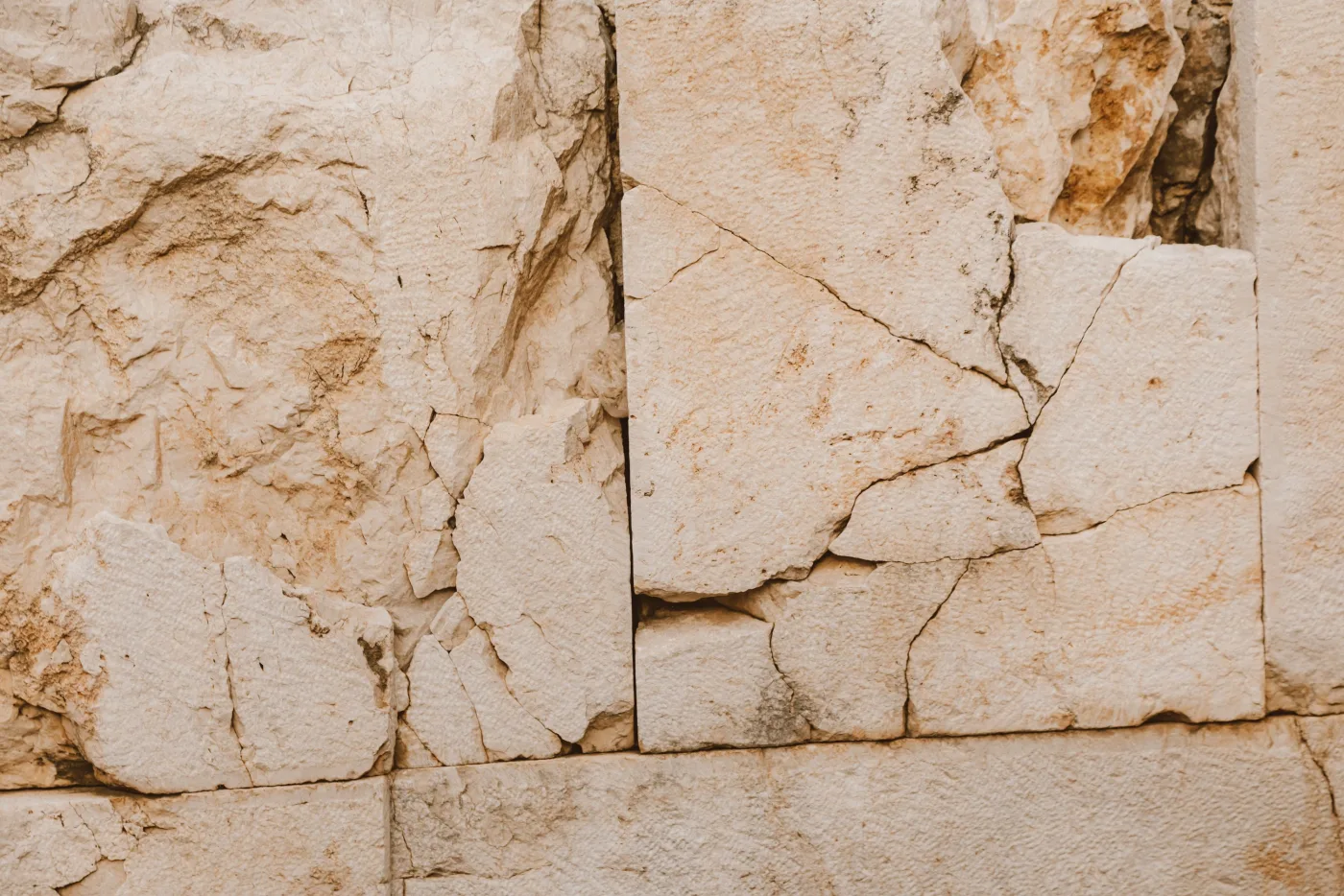 Close-up of quarried limestone block wall.
